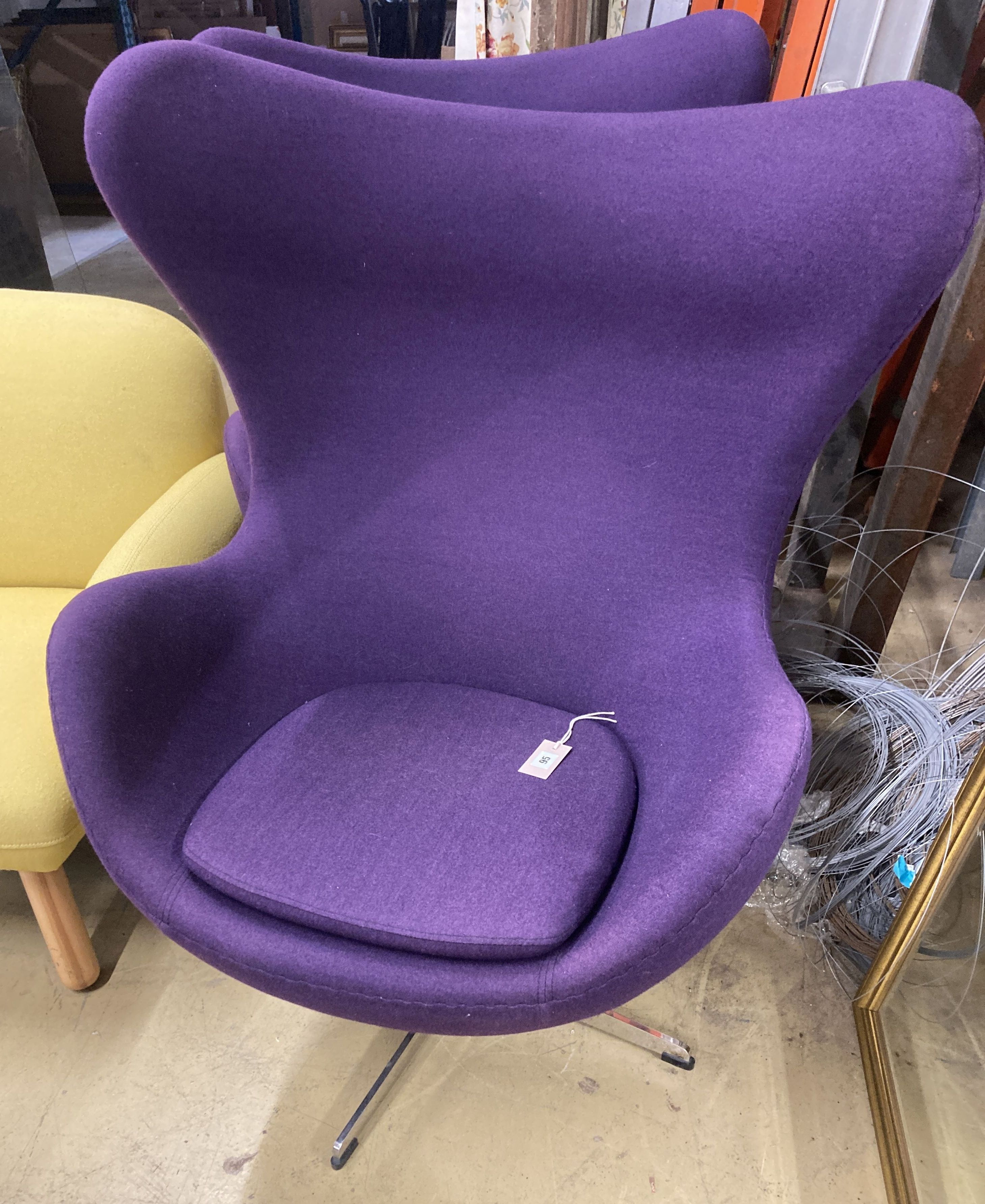 A pair of contemporary purple fabric egg chairs, width 85cm, depth 75cm, height 112cm